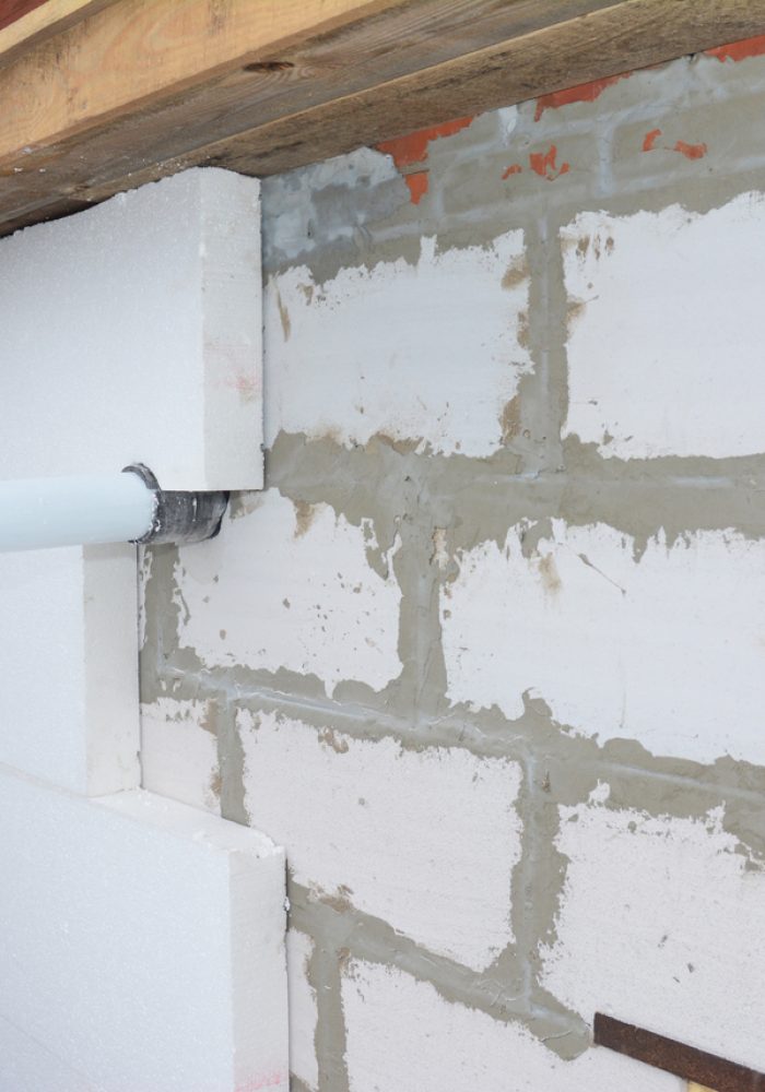 Installing rigid foam insulation around  gas convector chimney smoke pipe. Problem area.