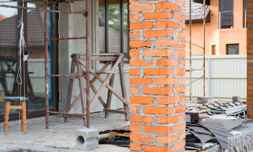 A private house is being constructed, Building a private house with red brick columns