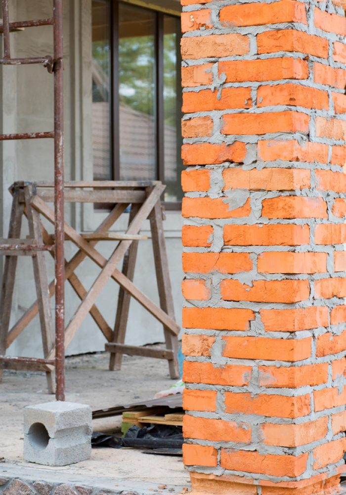 A private house is being constructed, Building a private house with red brick columns