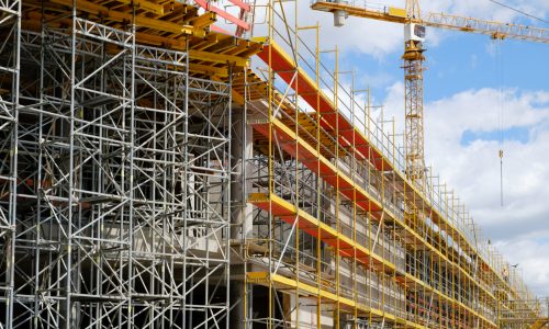 new building construction site - scaffolding and crane on building site